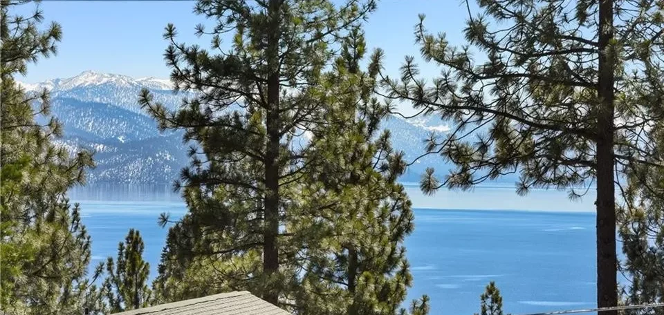 View of Lake Tahoe with snow capped mountains from Tahoe vacation rental